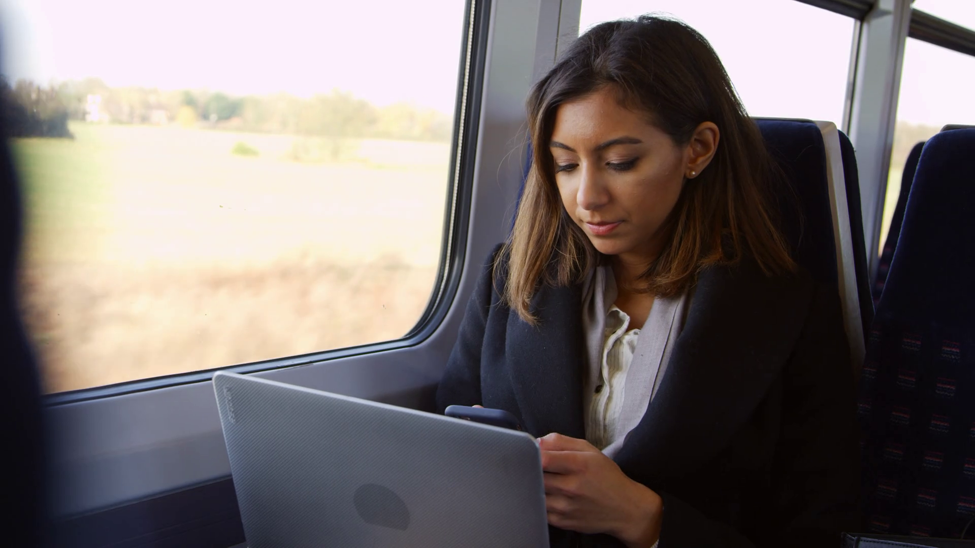 Laptop on a train, using tech on the go