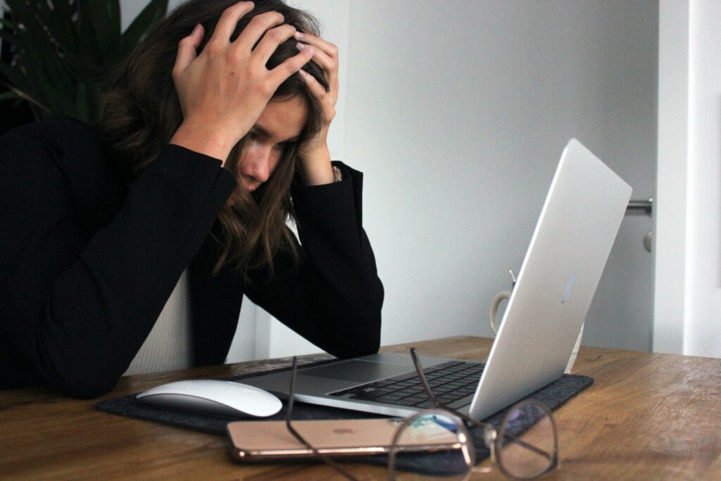 Image showing a stressed out person using a computer.